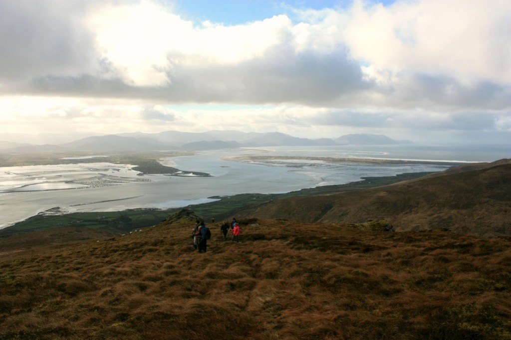 Walkers on the slopes of Caherconree overlooking the coast